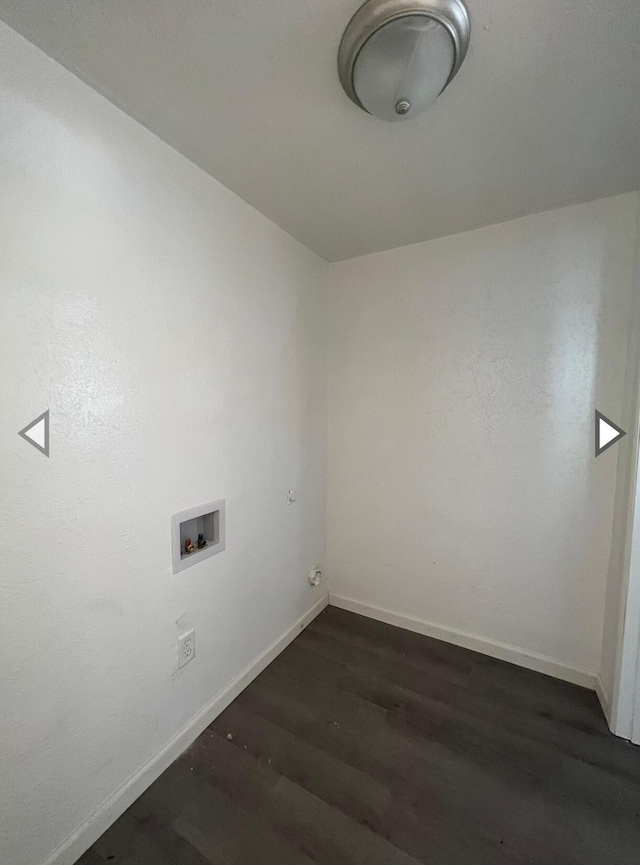 laundry area with baseboards, laundry area, dark wood finished floors, and washer hookup