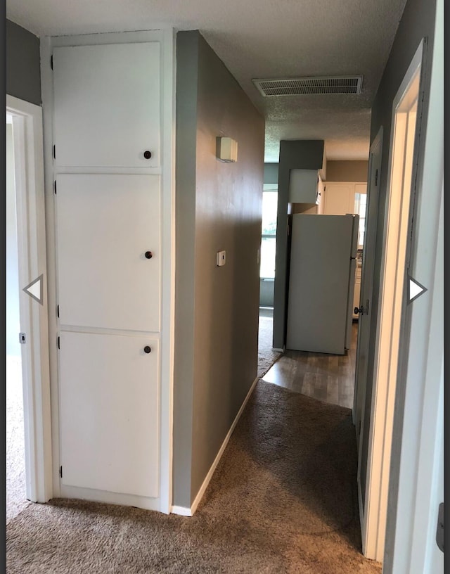 928 N Glenn Ave, Springfield, MO 65803 - hall featuring visible vents, carpet flooring, and baseboards