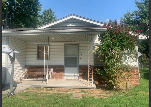 928 N Glenn Ave, Springfield, MO 65803 - exterior space with covered porch and brick siding