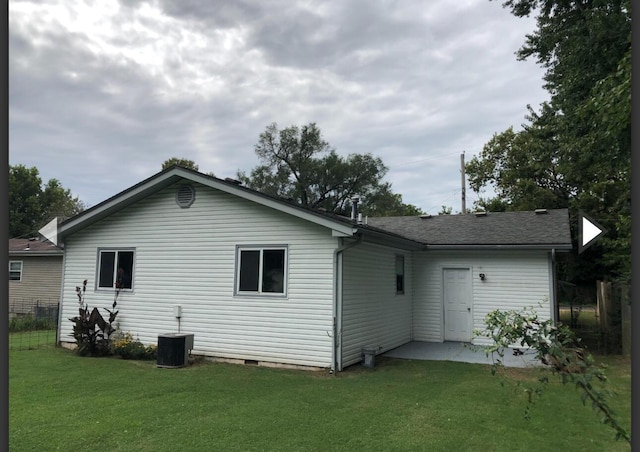 928 N Glenn Ave, Springfield, MO 65803 - back of house featuring a yard, crawl space, central AC, and fence