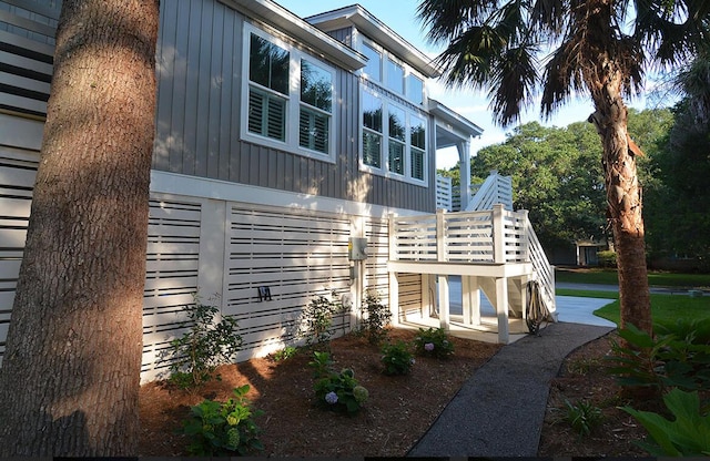 rear view of property featuring a deck