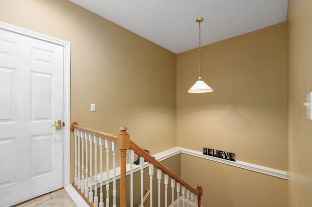 stairs with tile patterned floors