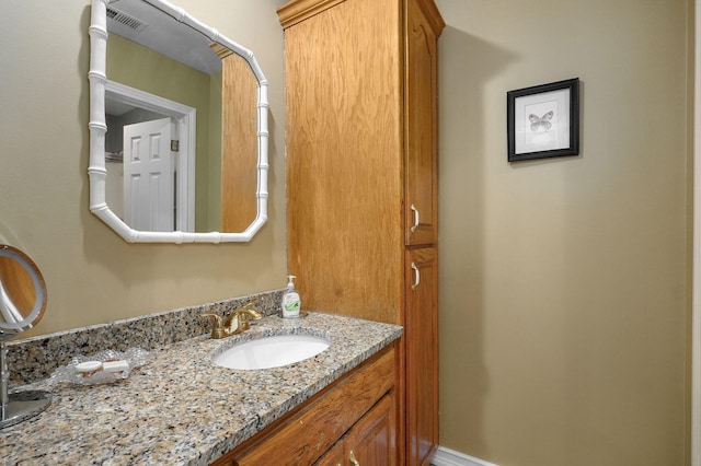 bathroom with vanity and visible vents