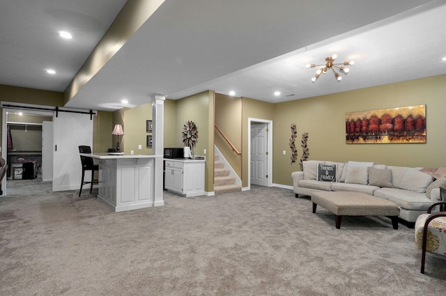 living area featuring stairs, recessed lighting, a barn door, and light carpet