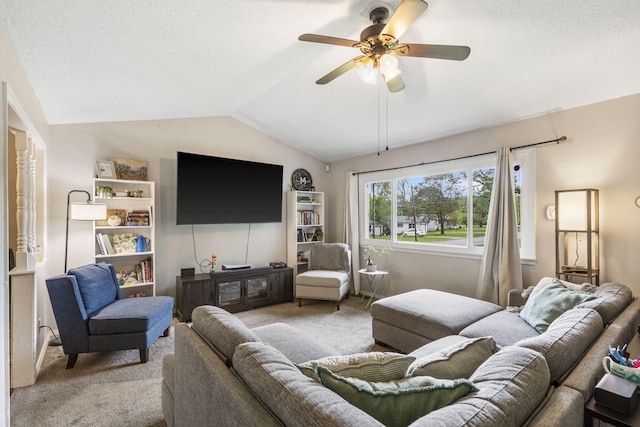 carpeted living room with a ceiling fan, a textured ceiling, and lofted ceiling