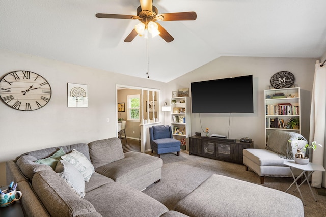 living area featuring carpet floors, ceiling fan, and lofted ceiling