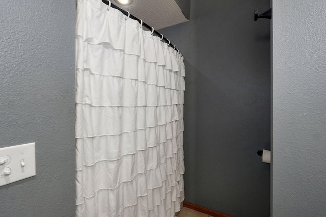 bathroom with curtained shower