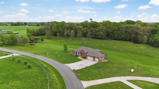 birds eye view of property with a rural view