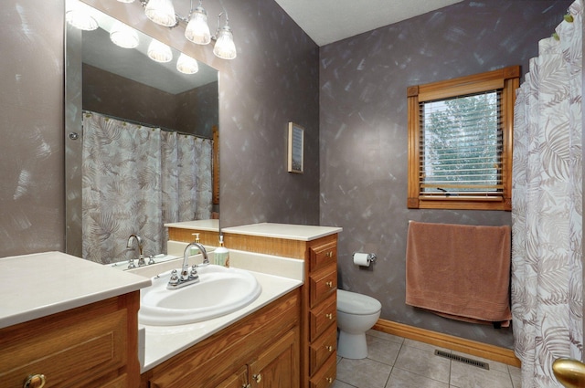 full bathroom with toilet, tile patterned floors, visible vents, and vanity