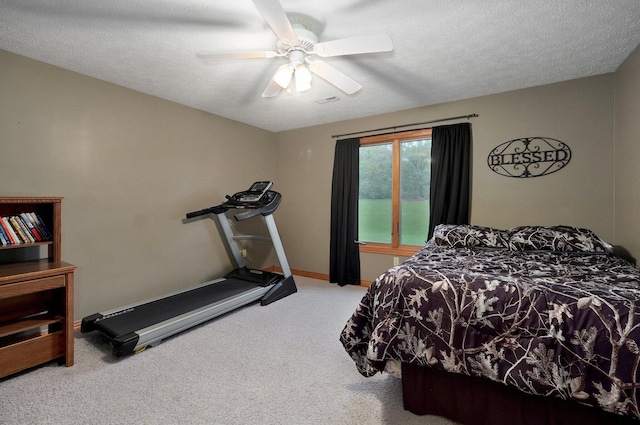 carpeted bedroom featuring a ceiling fan and baseboards