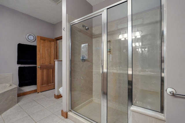 full bath featuring tile patterned floors, a bath, and a stall shower