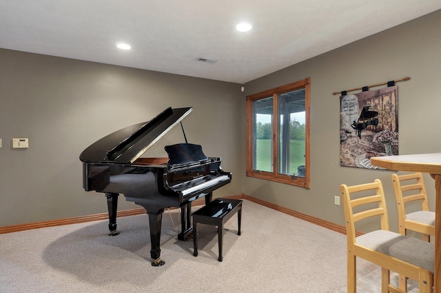 living area with baseboards, light colored carpet, recessed lighting, and visible vents