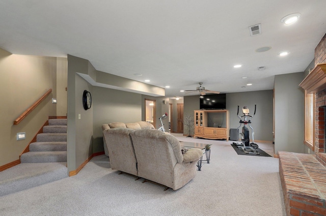 living room with stairs, baseboards, visible vents, and light carpet