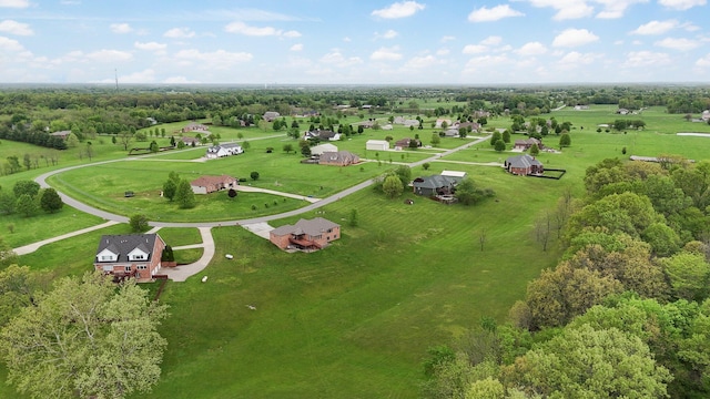 birds eye view of property featuring a rural view