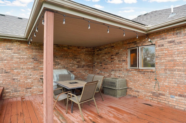 wooden terrace featuring outdoor dining space