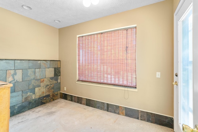 empty room with a textured ceiling