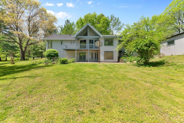 back of property featuring a lawn