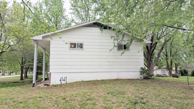 view of home's exterior featuring a yard