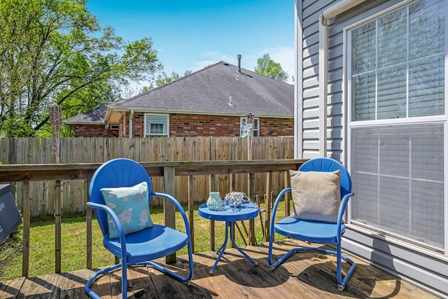 wooden deck featuring fence