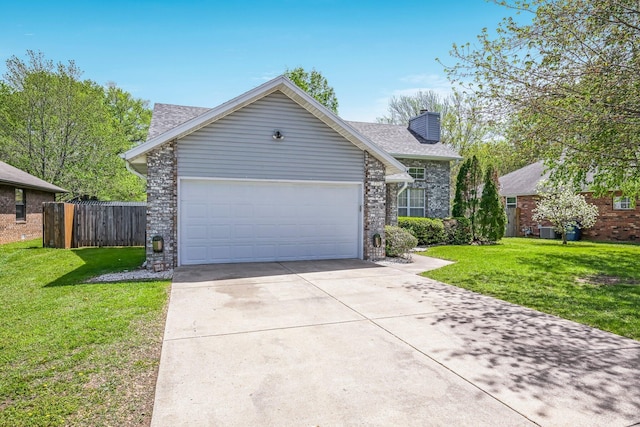 ranch-style home with fence, a front yard, a chimney, concrete driveway, and an attached garage