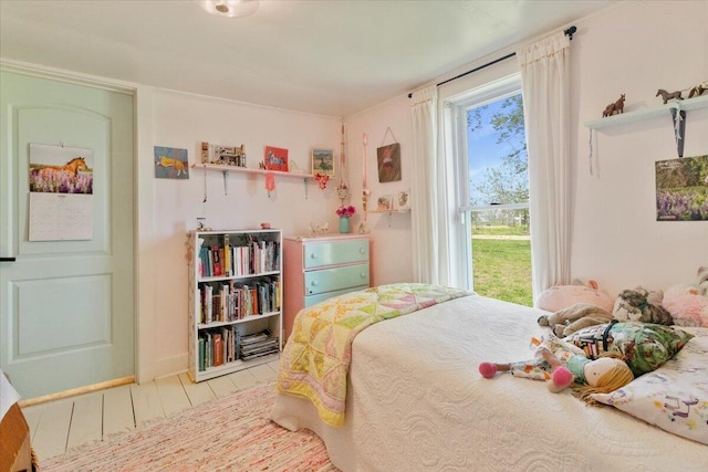 bedroom with wood finished floors