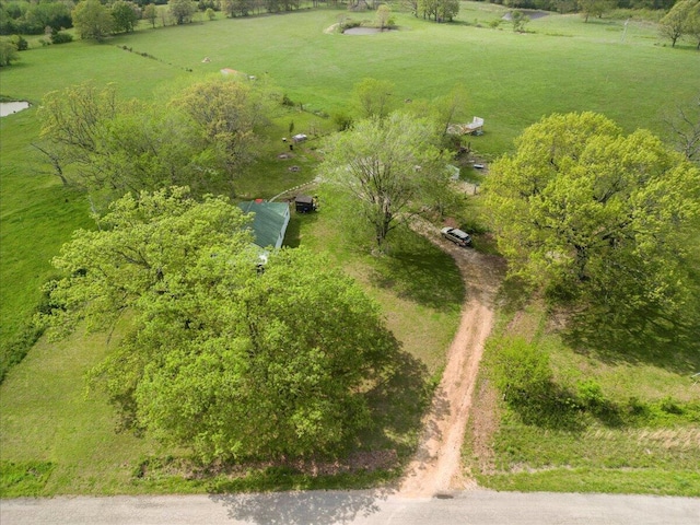 birds eye view of property with a rural view