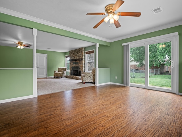 1208 Kemp Dr, Bolivar, MO 65613 - unfurnished living room with crown molding, ceiling fan, a fireplace, baseboards, and visible vents