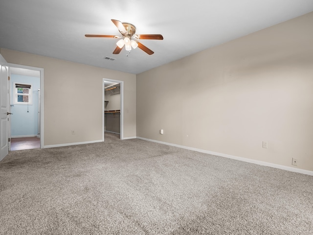 1208 Kemp Dr, Bolivar, MO 65613 - unfurnished bedroom featuring baseboards, visible vents, carpet, and a spacious closet