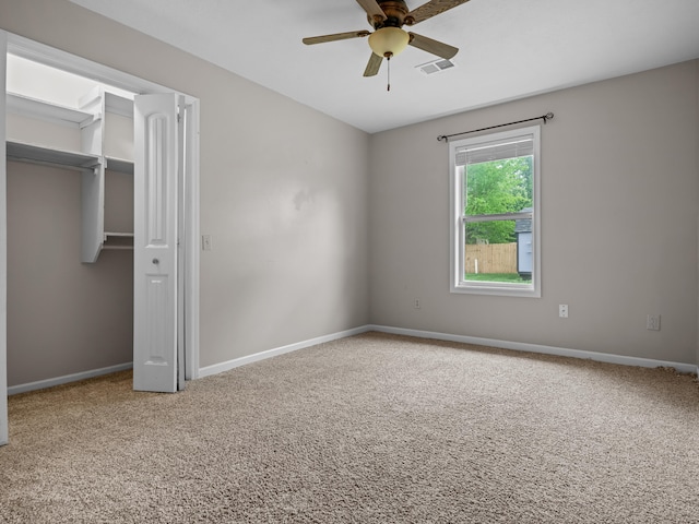 1208 Kemp Dr, Bolivar, MO 65613 - unfurnished bedroom featuring visible vents, a ceiling fan, a closet, baseboards, and carpet flooring