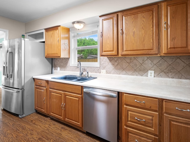 1208 Kemp Dr, Bolivar, MO 65613 - kitchen featuring light countertops, stainless steel appliances, a sink, and dark wood-style flooring