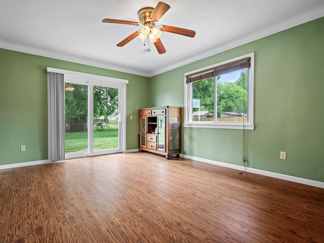1208 Kemp Dr, Bolivar, MO 65613 - spare room with baseboards, ornamental molding, a ceiling fan, and wood finished floors