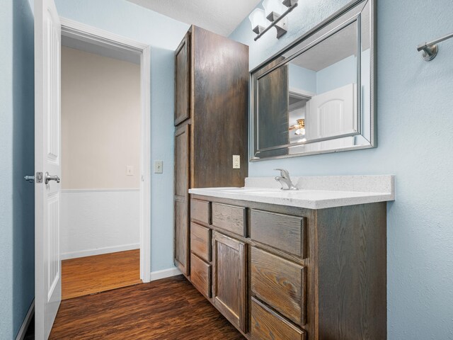 1208 Kemp Dr, Bolivar, MO 65613 - bathroom with vanity, baseboards, and wood finished floors