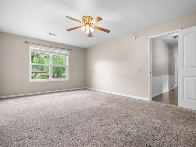 1208 Kemp Dr, Bolivar, MO 65613 - carpeted empty room featuring ceiling fan, visible vents, and baseboards