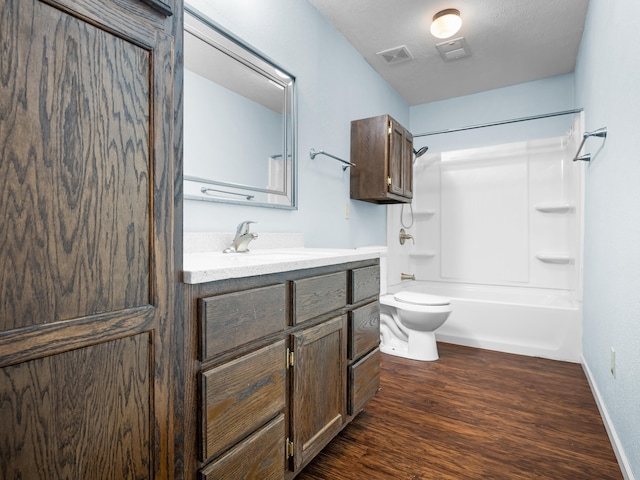 1208 Kemp Dr, Bolivar, MO 65613 - full bath featuring bathtub / shower combination, vanity, toilet, wood finished floors, and visible vents