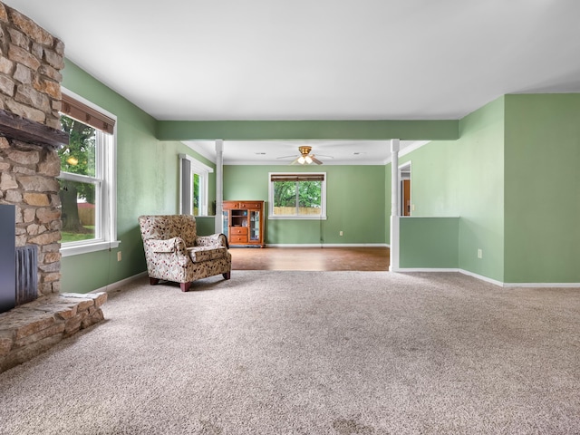 1208 Kemp Dr, Bolivar, MO 65613 - sitting room with carpet floors, baseboards, ceiling fan, and a fireplace