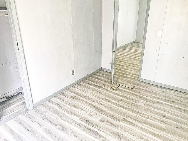 interior space featuring a closet and wood finished floors