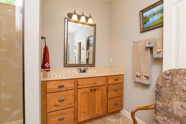 full bathroom with baseboards and vanity