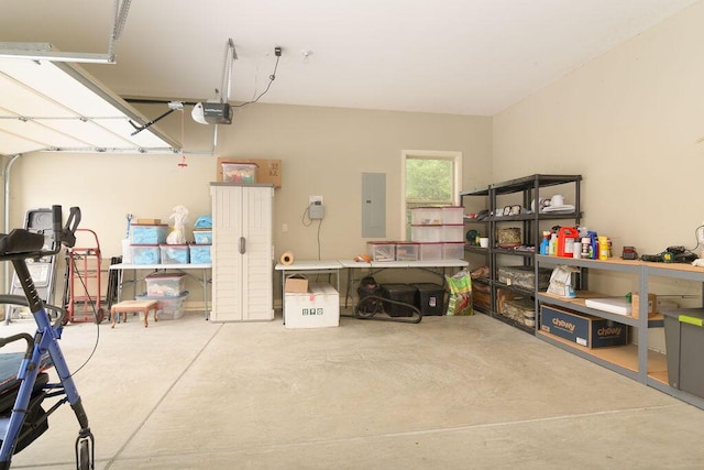 garage with a garage door opener and electric panel