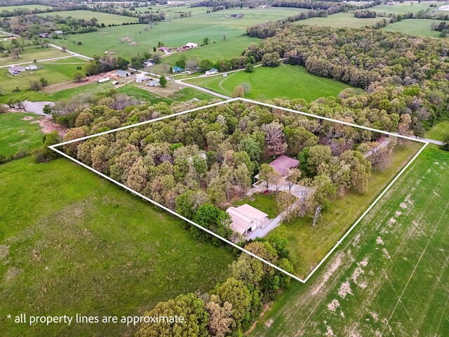 birds eye view of property with a rural view