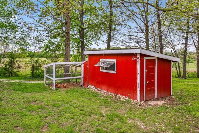 view of poultry coop with a yard