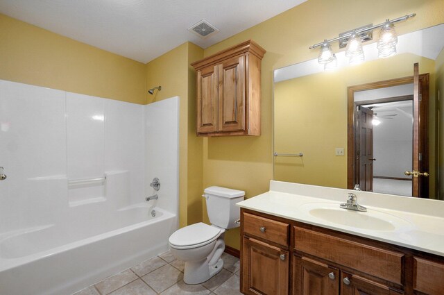bathroom featuring visible vents, vanity, toilet, shower / bathing tub combination, and tile patterned floors