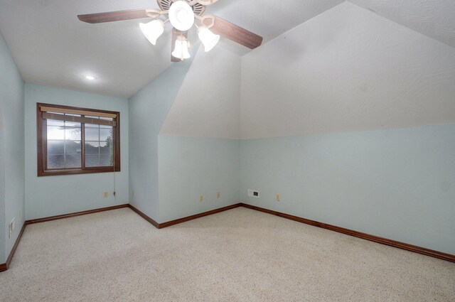 bonus room featuring baseboards, ceiling fan, vaulted ceiling, and carpet flooring