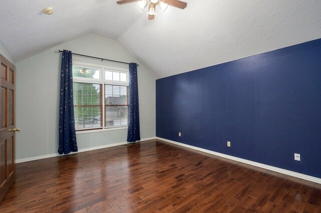 additional living space featuring wood finished floors, a ceiling fan, baseboards, and lofted ceiling