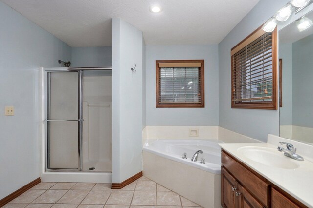 full bathroom featuring baseboards, vanity, and a shower stall