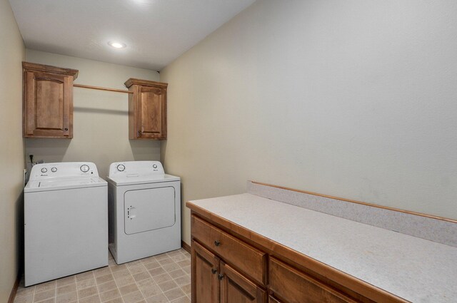 laundry room with recessed lighting, cabinet space, and washer and dryer