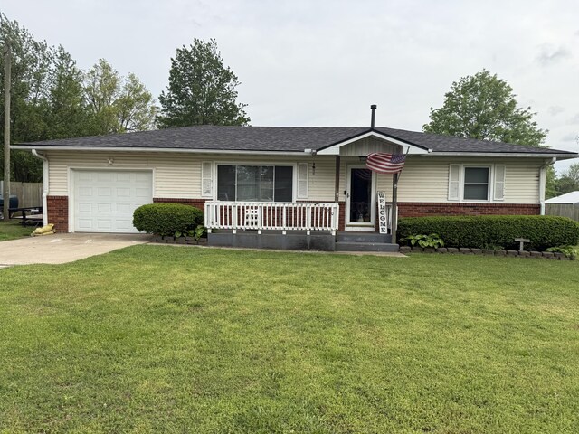 single story home featuring covered porch, brick siding, a front lawn, concrete driveway, and an attached garage