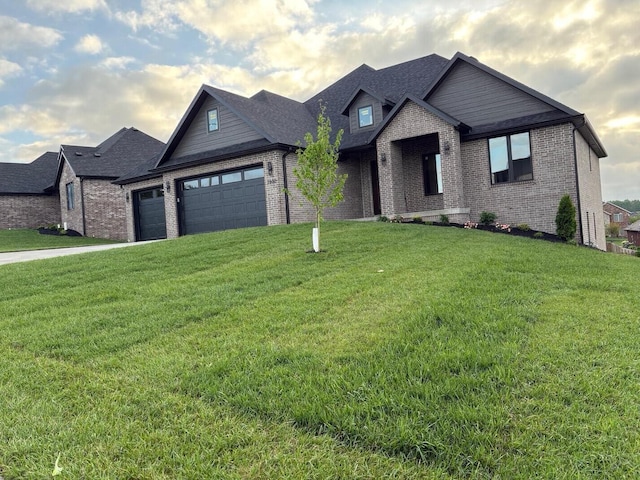 craftsman house with brick siding, an attached garage, and a front lawn