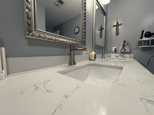 details with visible vents and vanity