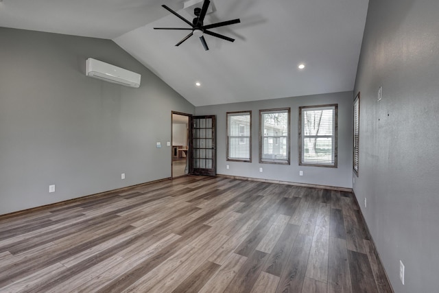unfurnished room featuring wood finished floors, recessed lighting, ceiling fan, and a wall unit AC