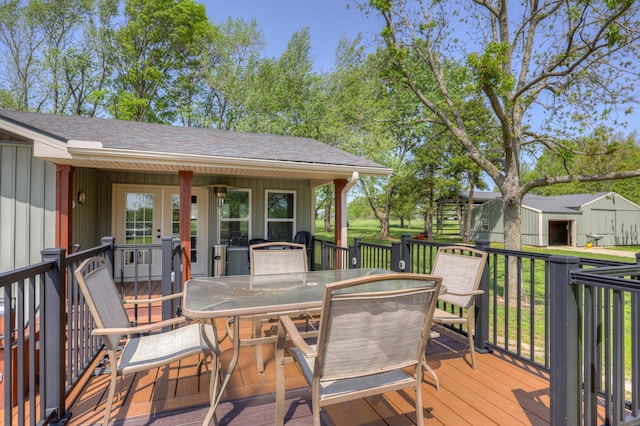 wooden terrace with outdoor dining space